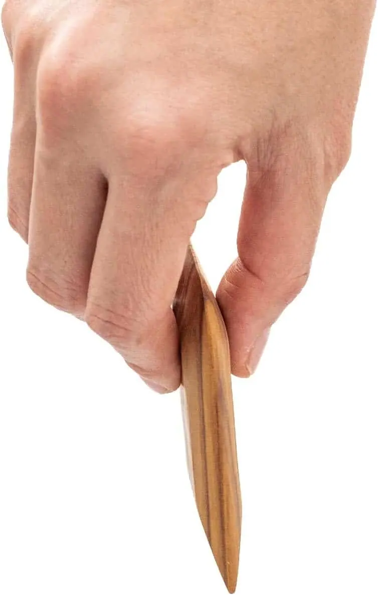 Handcrafted wooden nail brush for eco-conscious grooming and natural nail care.
