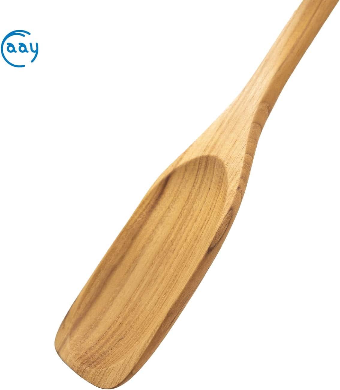 A close-up of a smooth, handcrafted wooden spoon made from natural oak wood, ideal for cooking and kitchen tasks.