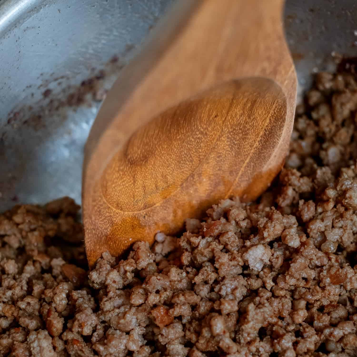 Juicy ground beef sizzling in a pan, perfect for tacos, burritos, or pasta dishes.